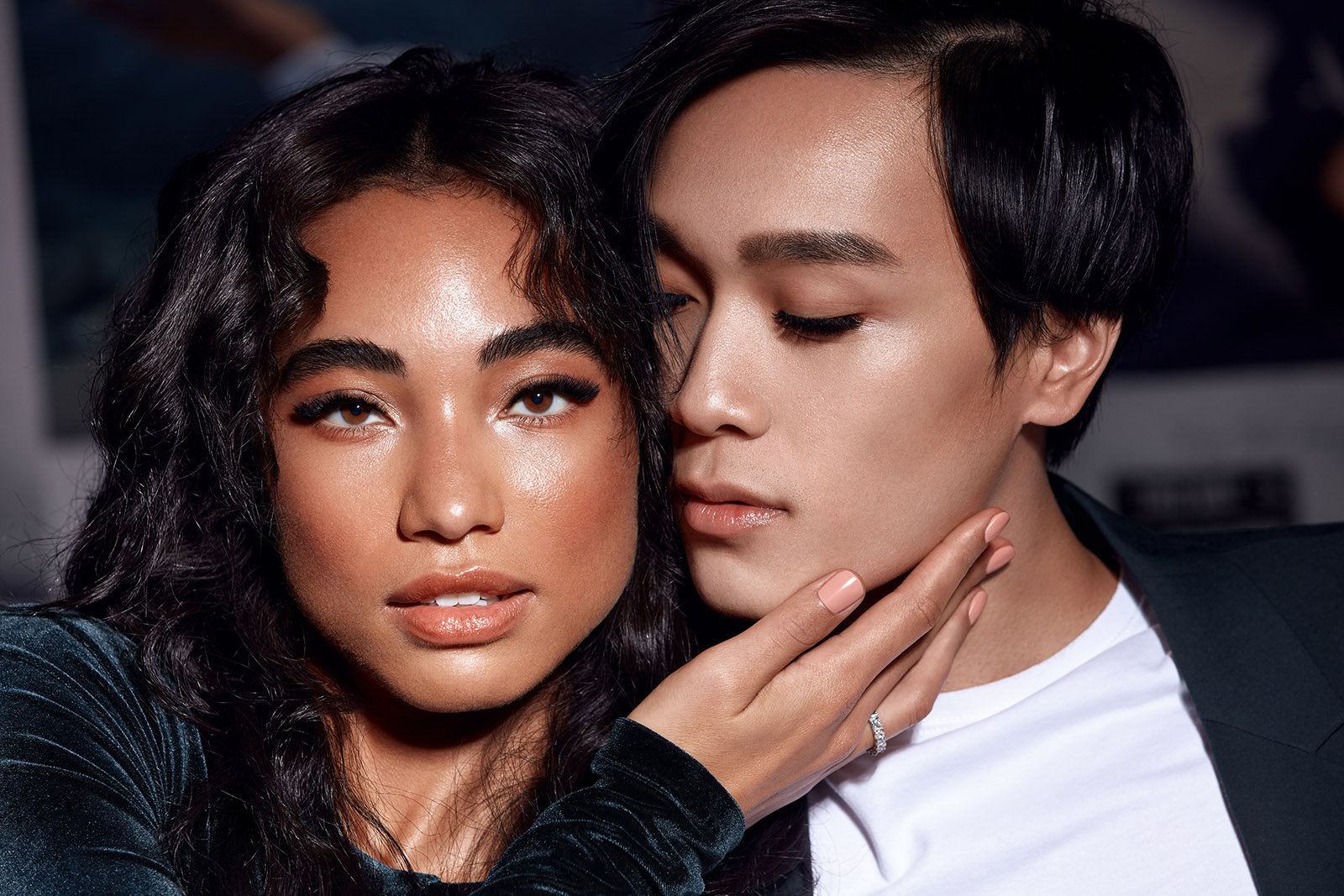 beautiful beauty photoshoot of dark-haired couple with tanned model faces